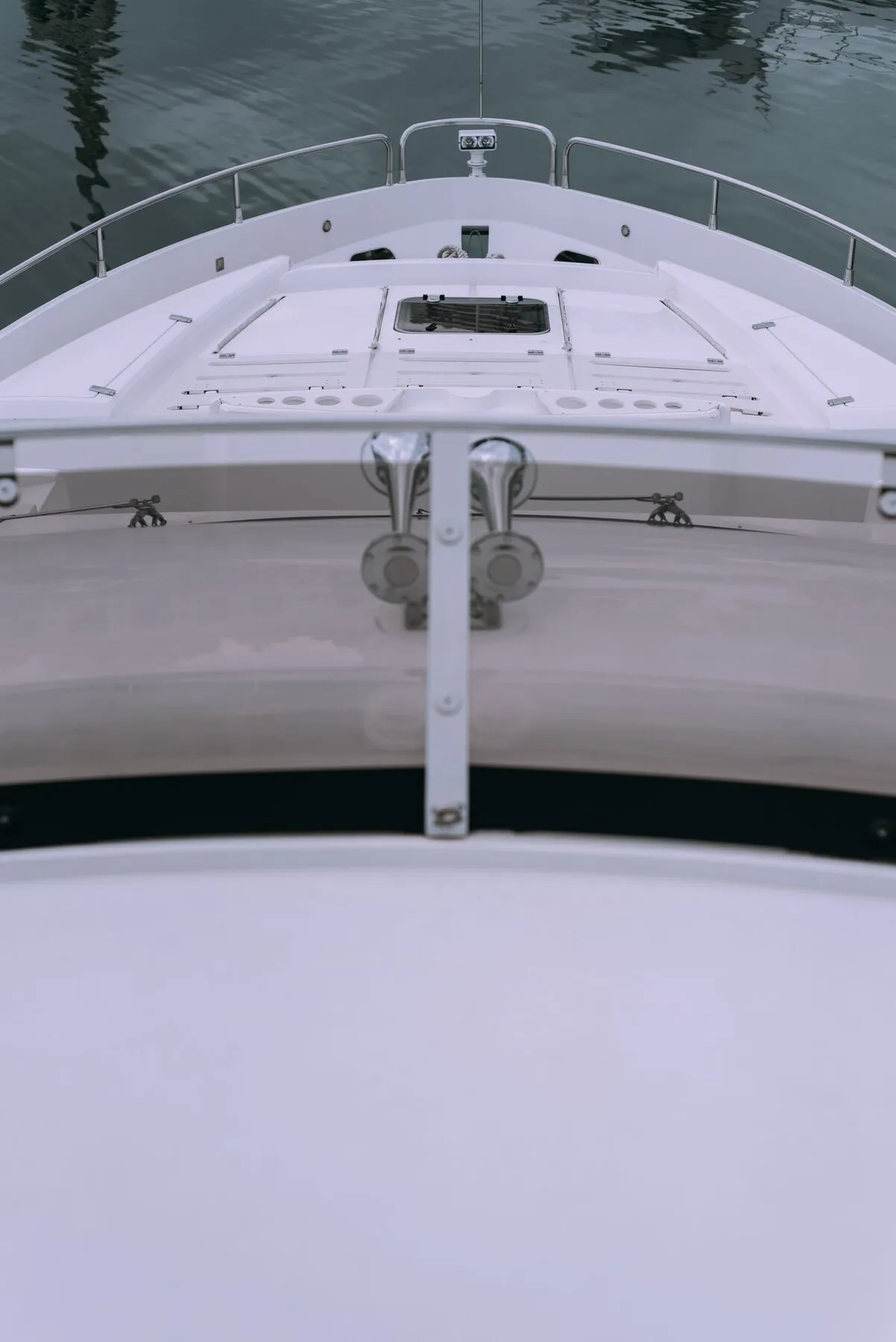 White foredeck and bow of a motor yacht